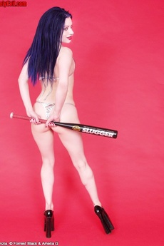 Flexible Pierced Punk Girl Plays With Baseball Bat