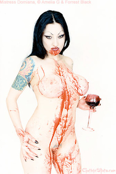 Tattooed Vampire Girl Covers Herself In Blood
