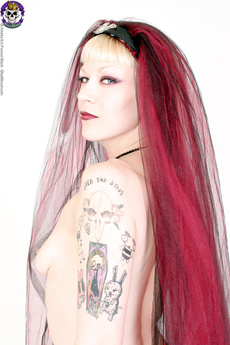 Tattooed Girl With Long Red Hair Loves Guns