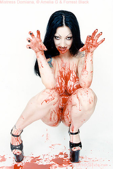 Tattooed Vampire Girl Covers Herself In Blood