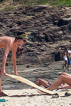 Charlize Theron Topless Sunbathing In Thong Bikini